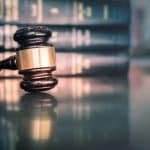 Lawyers being helped in court by TimeBinder verifying legal documents on the blockchain.